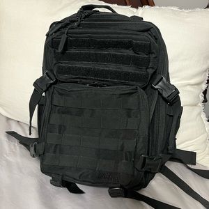 Wolfpak 35L backpack. NWT. Nonsmoking pet friendly house.